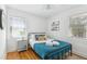 Cozy bedroom with a metal frame bed, bright natural light, and calming decor at 4503 Overbrook Ave, North Charleston, SC 29405