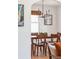 Bright dining area features wooden dining set and a modern chandelier at 4503 Overbrook Ave, North Charleston, SC 29405