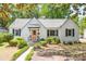 Charming painted brick home featuring a walkway to the front door and manicured landscaping at 4503 Overbrook Ave, North Charleston, SC 29405