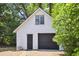 Garage exterior featuring a door, a window, and beautiful trees at 4503 Overbrook Ave, North Charleston, SC 29405