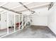 Spacious garage interior featuring stairs and concrete floors at 4503 Overbrook Ave, North Charleston, SC 29405