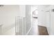 Hallway with wooden floors, painted brick, and a view of the bedroom at 4503 Overbrook Ave, North Charleston, SC 29405