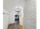 Hallway leading to a bedroom with a white-painted brick accent wall at 4503 Overbrook Ave, North Charleston, SC 29405