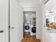 Convenient laundry room with modern washer and dryer, plus storage shelving at 4503 Overbrook Ave, North Charleston, SC 29405