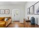 Bright living room features hardwood floors, statement art and neutral walls at 4503 Overbrook Ave, North Charleston, SC 29405