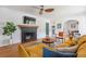 Inviting living room boasts brick fireplace, ceiling fan, and comfortable seating at 4503 Overbrook Ave, North Charleston, SC 29405