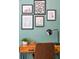 Office features a wooden desk with a potted plant, art, and a comfortable leather chair at 4503 Overbrook Ave, North Charleston, SC 29405
