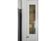 Textured glass pantry door next to stainless steel refrigerator at 4503 Overbrook Ave, North Charleston, SC 29405