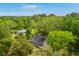 Aerial view showcasing the home's location amidst lush greenery and a picturesque landscape at 4942 Storage Rd, Meggett, SC 29449