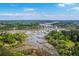 Overhead view captures the home's scenic riverfront location with winding waterways and verdant landscape at 4942 Storage Rd, Meggett, SC 29449