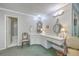 Spacious bathroom featuring a long vanity with dual mirrors and sinks, complemented by classic fixtures and ample counter space at 4942 Storage Rd, Meggett, SC 29449