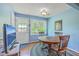 Quaint dining room features a round table, garden view window, and natural light at 4942 Storage Rd, Meggett, SC 29449