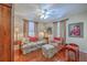 Comfortable living room with hardwood floors, traditional furnishings, and decorative lamps, creating a cozy, inviting space at 4942 Storage Rd, Meggett, SC 29449