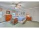 Comfortable main bedroom featuring a ceiling fan, dresser, and serene ambiance at 4942 Storage Rd, Meggett, SC 29449