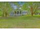 Lovely home exterior with a screened-in porch perfect for enjoying the outdoors at 4942 Storage Rd, Meggett, SC 29449