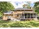 Home exterior featuring a white deck, screened porch, and large backyard at 501 Willow Branch Way, Mount Pleasant, SC 29464