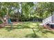 Spacious backyard featuring a playground, green lawn and well-manicured landscaping at 501 Willow Branch Way, Mount Pleasant, SC 29464