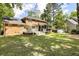 Expansive backyard featuring a deck, screened-in porch, and lush lawn at 501 Willow Branch Way, Mount Pleasant, SC 29464