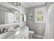 Well-lit bathroom with marble countertops, double vanity, and white subway tile at 501 Willow Branch Way, Mount Pleasant, SC 29464