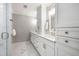 Bright bathroom featuring double sinks, updated fixtures, and tiled floors at 501 Willow Branch Way, Mount Pleasant, SC 29464