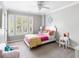 Bright bedroom featuring large windows, plush carpet and a charming vanity at 501 Willow Branch Way, Mount Pleasant, SC 29464