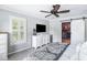 Bright bedroom featuring walk-in closet with barn door and television at 501 Willow Branch Way, Mount Pleasant, SC 29464