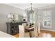 Elegant dining room with hardwood floors, designer lighting, and sophisticated decor at 501 Willow Branch Way, Mount Pleasant, SC 29464