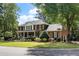 Charming two-story home with a manicured lawn and inviting front porch at 501 Willow Branch Way, Mount Pleasant, SC 29464
