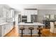Modern kitchen featuring white cabinets, stainless steel appliances, and a center island with seating at 501 Willow Branch Way, Mount Pleasant, SC 29464