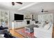 Bright living room with a fireplace, built-in shelving, and ample natural light at 501 Willow Branch Way, Mount Pleasant, SC 29464