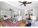Open-concept living area with hardwood floors and views into the dining space at 501 Willow Branch Way, Mount Pleasant, SC 29464