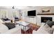 Elegant living room featuring a fireplace, hardwood floors, and comfortable seating at 501 Willow Branch Way, Mount Pleasant, SC 29464