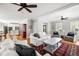 Open-concept living room with hardwood floors, a comfortable seating arrangement, and views to the kitchen at 501 Willow Branch Way, Mount Pleasant, SC 29464