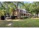 Brick two-story home with black trim and a private side yard featuring a boat at 501 Willow Branch Way, Mount Pleasant, SC 29464