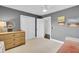 A nicely decorated guest bedroom with a dresser, ceiling fan, closet, and neutral color palette at 5029 Victoria Ave, North Charleston, SC 29405