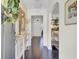 Inviting entryway featuring hardwood floors, an accent wall, and decorative console table at 5029 Victoria Ave, North Charleston, SC 29405