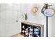 Entryway with coat rack, shoe storage, and decorative sunflower mirror at 5029 Victoria Ave, North Charleston, SC 29405