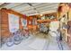 Spacious garage with storage, bikes, and golf cart offers ample room for hobbies and equipment at 5029 Victoria Ave, North Charleston, SC 29405