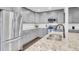 Kitchen with stainless steel appliances, granite countertops, and gray custom cabinetry at 5029 Victoria Ave, North Charleston, SC 29405