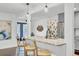 Open kitchen features a granite-topped island with bar seating and stainless steel appliances at 5029 Victoria Ave, North Charleston, SC 29405