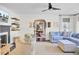 Bright living room featuring a fireplace, TV, stylish furniture, and dining room access at 5029 Victoria Ave, North Charleston, SC 29405