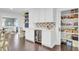 Well-organized pantry features custom shelving and a beverage cooler for added convenience at 5029 Victoria Ave, North Charleston, SC 29405