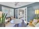 Bright sitting room with white accents, featuring comfortable chairs and stylish decor at 5029 Victoria Ave, North Charleston, SC 29405