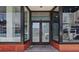 Exterior view of the building's main entrance with glass doors and visible signage at 517 King St # 13, Charleston, SC 29403