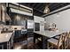 Modern kitchen with dark cabinets, an open ceiling, and a spacious island at 517 King St # 13, Charleston, SC 29403