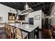 Expansive kitchen with a white marble island, modern finishes, and open ceiling concept at 517 King St # 13, Charleston, SC 29403