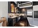 Sleek kitchen with dark cabinets, stainless steel appliances, and marble countertops at 517 King St # 13, Charleston, SC 29403