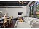Inviting living room with stylish decor, open ceiling, and an eat-in kitchen island at 517 King St # 13, Charleston, SC 29403