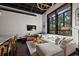 Living room features an open ceiling, a large window, and access to an eat-in kitchen at 517 King St # 13, Charleston, SC 29403