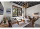 Cozy living room featuring a neutral color palette, large window, and unique art work at 517 King St # 13, Charleston, SC 29403